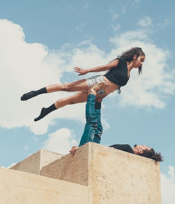 Man performing a controlled strength exercise in a calm, minimalist environment.